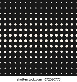 Vector monochrome seamless pattern. Halftone dots, different sized circles. Gradient transition visual effect. Abstract spotted background. Simple modern geometric texture. Dark stylish design element