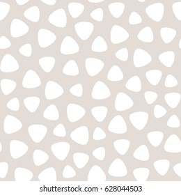 Vector monochrome seamless pattern in pale pastel colors, white geometric spots on beige background, round triangles. Abstract texture for fabric print, card, cloth, furniture, cover, decoration, web