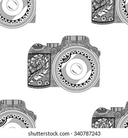 Vector monochrome seamless pattern with retro camera in hand drawn style isolated on white background with beautiful floral pattern inside. Vector illustration