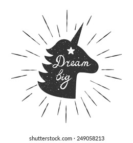 Vector motivation card with unicorn silhouette, sunbursts, and text "Dream big". Stylish vintage background with inspirational words.