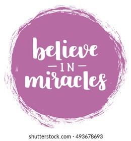 Vector motivational quote - Believe in miracles. Hand written brush lettering on bodacious trend color textured circle. Vector hand drawn typographic poster slogan for your design.