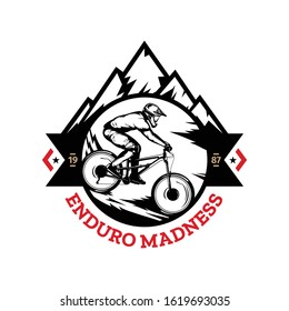 Vector mountain biking badge, logo, label with rider on a bike and mountain silhouette. Downhill, enduro, cross-country biking illustration