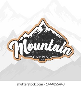 Vector mountain camping lettering logo, symbol or emblem with grunge texture on mountain landscape background