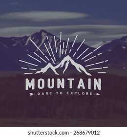 vector mountain exploration emblem. outdoor activity symbol with grunge texture on mountain landscape background