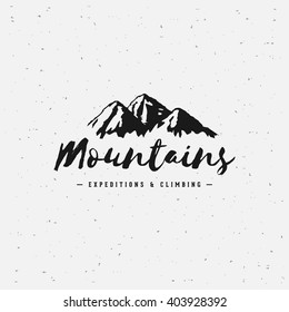 Vector mountains emblem. Outdoor activity symbol. Mountain Hand Drawn Logo.