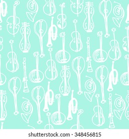 Vector musical instruments seamless pattern background with hand drawn elements.