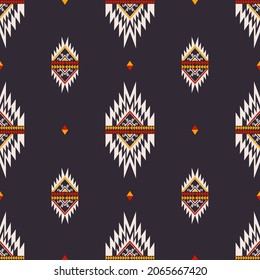 Vector native aztec small triangle shape seamless pattern background. Ethnic tribal red-yellow on dark blue color design. Use for fabric, textile, interior decoration elements, upholstery, wrapping.