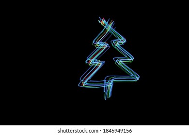 A vector of neon multi-colour in an abstract Christmas tree shape outline against a black background. Christmas festive feel