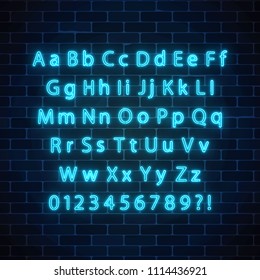 Vector neon style font. Glowing neon alphabet with uppercase and lowercase letters on dark brick wall background. You can made your words with it.