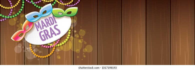 vector new orleans mardi gras vector horizontal banner background with blur lights, carnival mask and text on wooden backdrop. vector mardi gras party or fat tuesday purple poster design template
