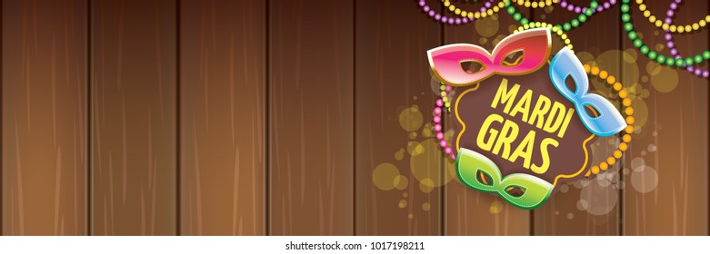 vector new orleans mardi gras vector horizontal banner background with blur lights, carnival mask and text on wooden backdrop. vector mardi gras party or fat tuesday purple poster design template