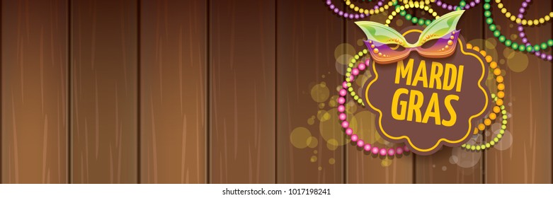 vector new orleans mardi gras vector horizontal banner background with blur lights, carnival mask and text on wooden backdrop. vector mardi gras party or fat tuesday purple poster design template