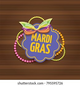vector new orleans mardi gras carnival label with mask and text on wooden wall background. vector mardi gras party or fat tuesday poster design template with space for text