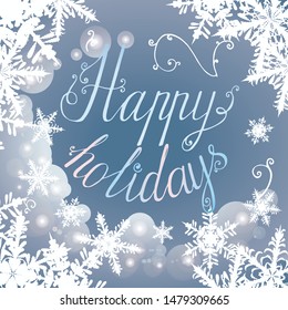 Vector New Year and Christmas greeting card template with hand written Happy holidays on blue background with lots of snow and shiny elements in classic or retro style