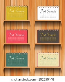 Vector Notebook on wooden shelves background