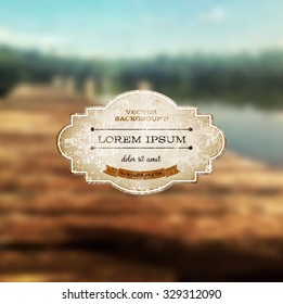 Vector old weathered vintage paper label over a retro photographic blurred bokeh background
