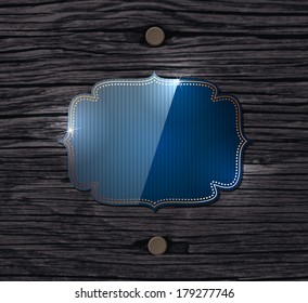 Vector old wood background with two nails and a blue glossy vintage banner