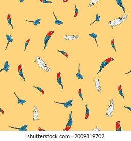 Vector orange background tropical birds, parrots, macaw, exotic cockatoo birds. Seamless pattern background