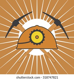 Vector orange mine helmet with a lamp and picks over yellow sunrise rays. Element for your design, safety posters and other industrial projects.
