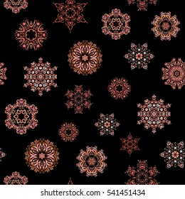 Vector orange, neutral and pink snowflakes on black background. Abstract minimal seamless pattern background.