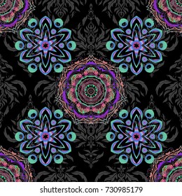 Vector oriental style arabesques. Seamless pattern with green, violet and pink elements, curls and ornaments on a black background.