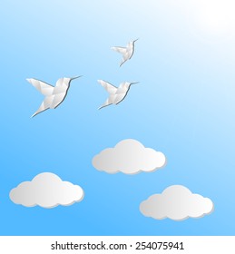 Vector origami colibri and clouds. Great for your design