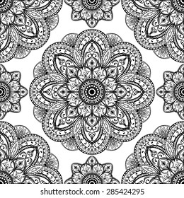 Vector, ornate pattern of mandalas. Oriental ornament of black elements on a white background. Template for cloth.