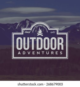 vector outdoor adventures emblem. outdoor activity symbol with grunge texture on mountain landscape background