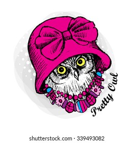Vector owl in a pink hat with bow. Pretty owlet with necklace.