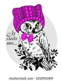 Vector owl with pink knitted hat and bow. Hand drawn illustration of owl.