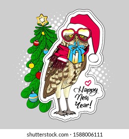 Vector owl - santa claus with a red cap, glasses, scarf and christmas tree. Hand drawn illustration of dressed owl. Happy New Year.