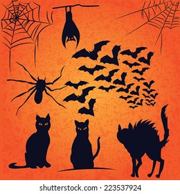 vector pack of bats cats spider and spiderweb silhouettes on orange grunge background