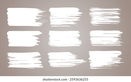 Vector paint brush set. White ink grunge brush strokes. Grunge design elements. Painted ink stripes. Creative isolated spots. Ink smudge, abstract shape stains and smear set