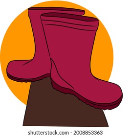 Vector un par de botas de goma impermeables