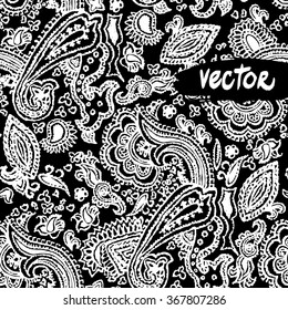 Vector paisley elements floral on a black background. Vector primitive paisley patterns seamless. Hand drawn vector floral