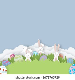 Vector paper cut. With rabbits, grassland, sky and Easter eggs. For Easter day background.