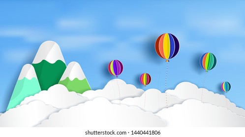 Vector paper cut. And there is a beautiful and colorful balloons floating above the clouds. And natural bright.And origami style design.and an illustration or background. 
