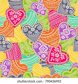 Vector pattern with a background of cookies with bright, multicolored glaze in the form of hearts. Valentine's Day. Original background for wallpaper, wrapping paper, textiles, surface textures.