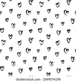 Vector pattern with black hearts. Linear silhouettes of hearts hand-drawn in charcoal. Romantic ink illustration. Black-white seamless pattern for Valentine's Day. Simple repeating chaotic texture.