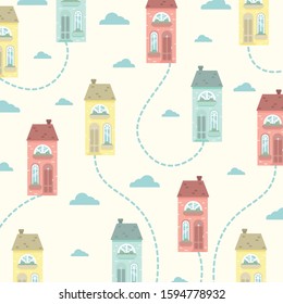 Vector pattern with colorful cute houses. Cartoon houses on a yellow background.
