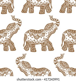 Vector pattern with indian elephants. Hand drawn doodle elephants with tribal ornament. Brown and white colors. Seamless background.