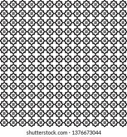 Vector pattern made with an abstract flower shape motif. Black and white moroccan style grid pattern.