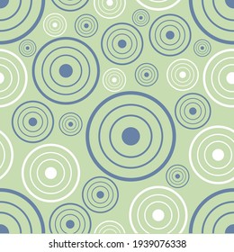 vector pattern on a green background, many circles of different sizes and colors for fabric
