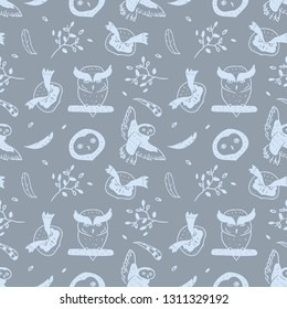 Vector pattern of owls and elements on gray background. Seamless illustration of birds, feathers and branch.