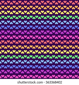 Vector pattern with rainbow hearts on dark violet background. Seamless pattern can be used for wallpaper, pattern fills, web page background,surface textures.