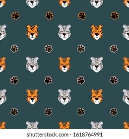 Vector pattern with snow leopard and jaguar head and paw prints. Seamless pattern for bed linen, wrapping paper, fabric. Vector illustration on dark green background
