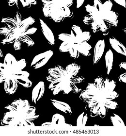 Vector pattern with white grunge flower on black background