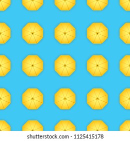 Vector pattern of yellow umbrellas. Background.
