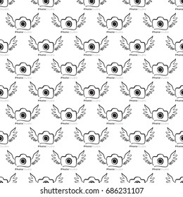 Vector photo camera with wings seamless pattern. Photography and photo studio hand drawn design signs, logos, identity, labels, badges, branding objects for business. Black sketch on white background.