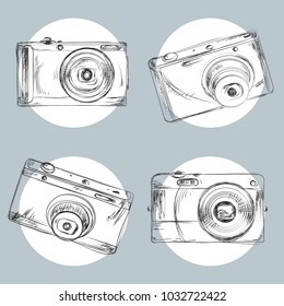 Vector photo cameras on the grey background. Hand drawing.